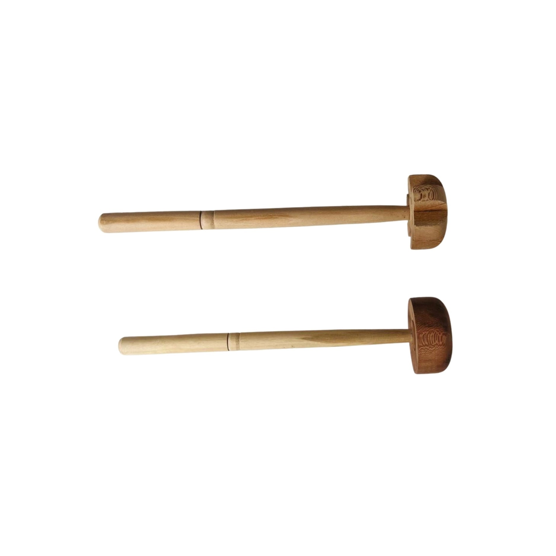 Two wooden mallets on a white background