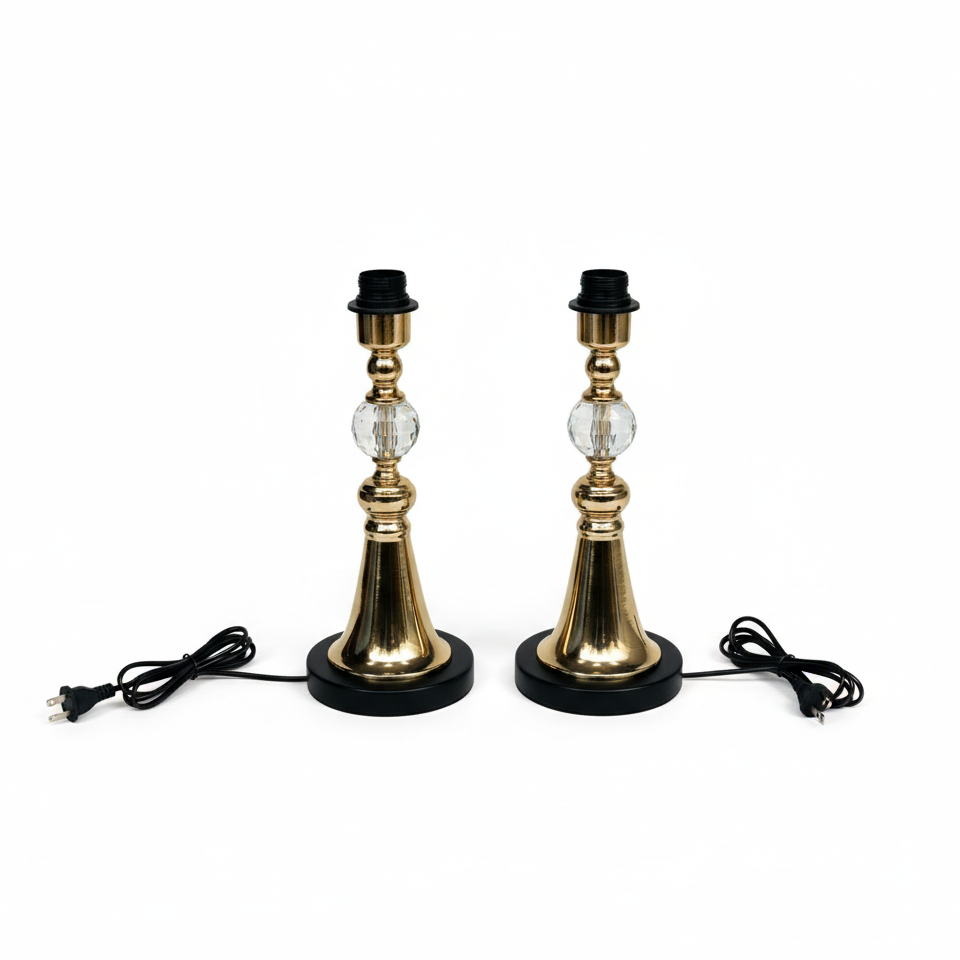 Two gold table lamps with black bases on a white background