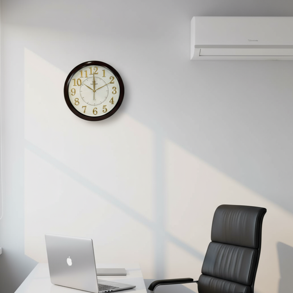 Modern office setup with a clock on the wall, laptop on a desk, and air conditioner above.
