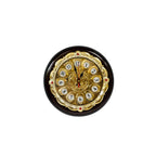 Decorative wall clock with gold and black design on a white background