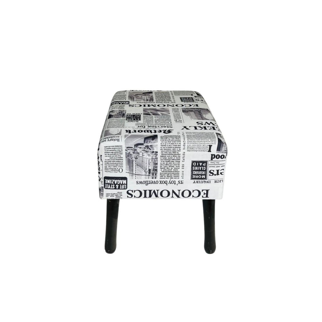 Stool with newspaper print pattern on a white background