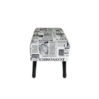 Stool with newspaper print pattern on a white background