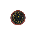 Round wall clock with black face and red frame on a white background