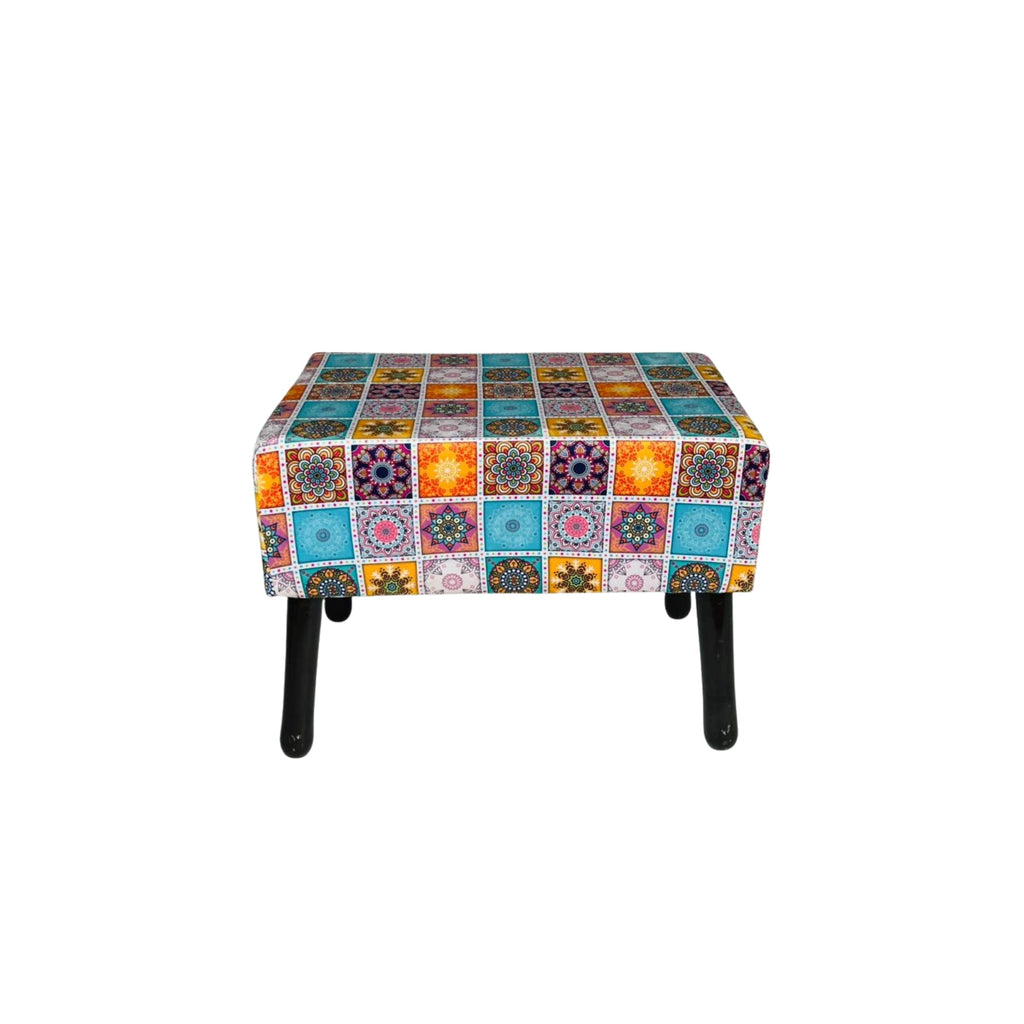 Multicolored patchwork ottoman on a white background