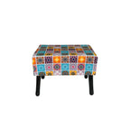 Multicolored patchwork ottoman on a white background