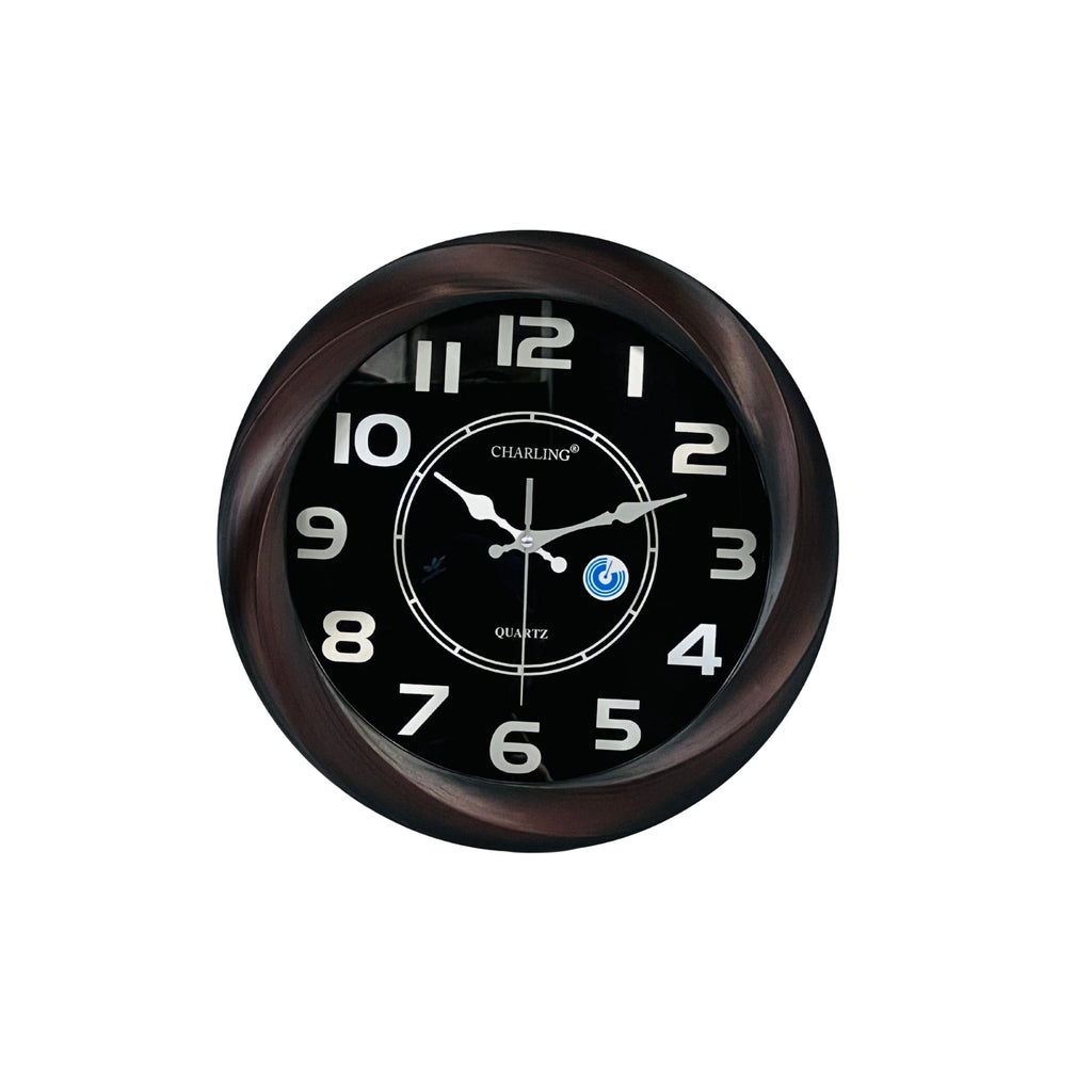 Round wall clock with black face and brown frame on a white background