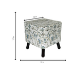 Floral-patterned ottoman with dimensions on a white background