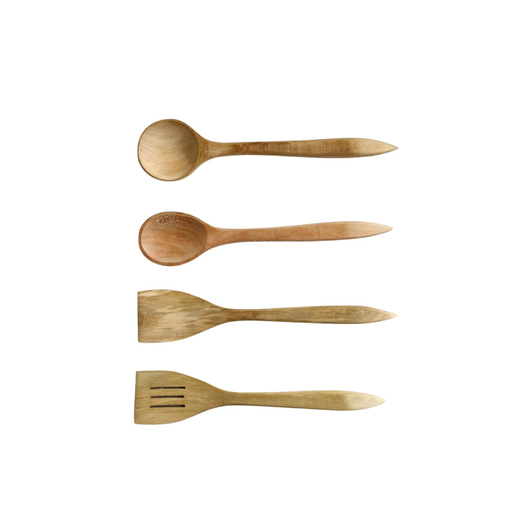 Set of four wooden kitchen utensils on a white background