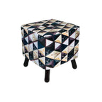 Cube-shaped ottoman with geometric pattern on a white background