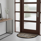 Modern interior with a glass door, welcome mat, and decorative elements.