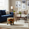 Living room with blue sofa, beige armchair, and colorful ottoman.