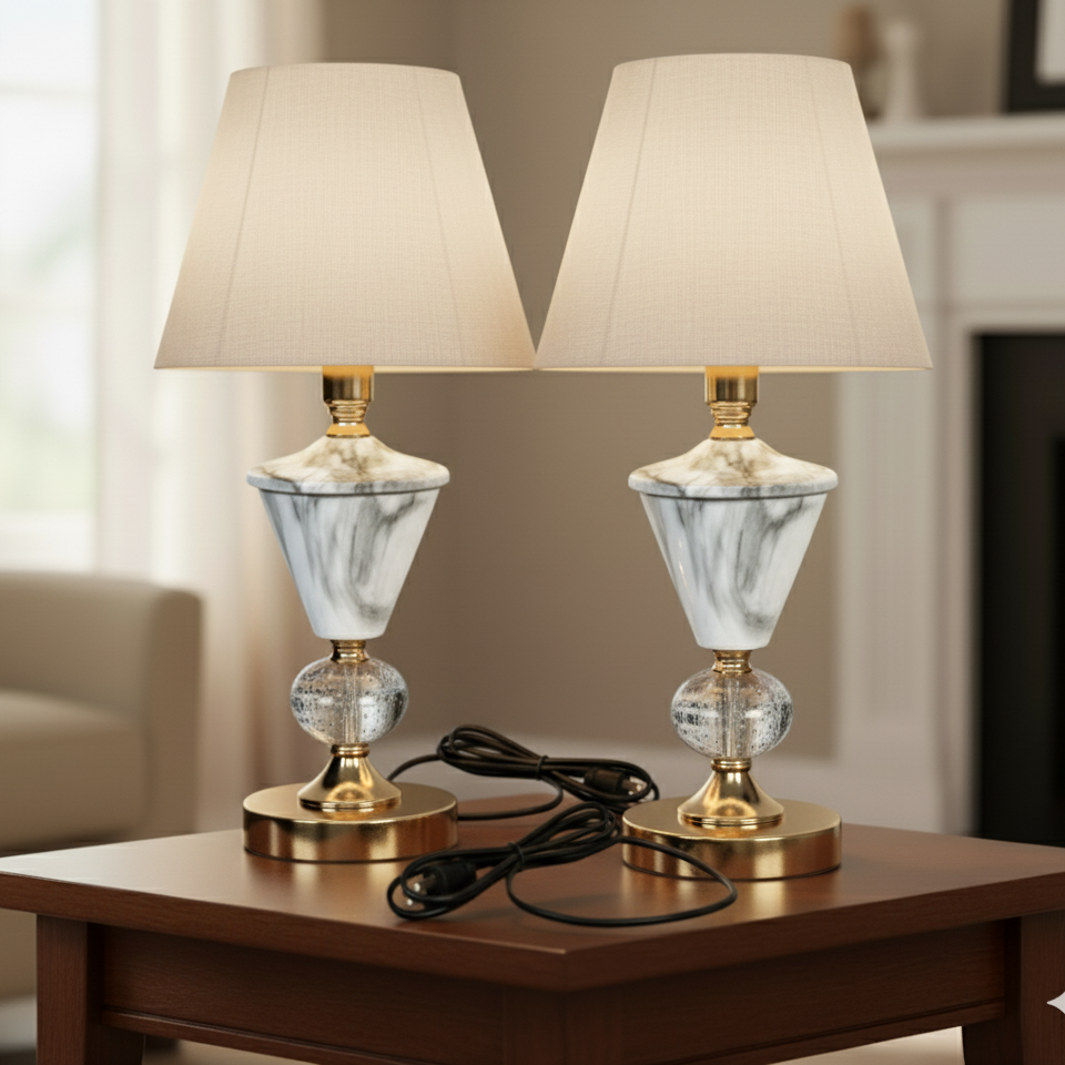 Two marble-patterned table lamps on a wooden table with a blurred background