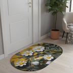 Floral patterned rug on a wooden floor with a plant and chair in the background.