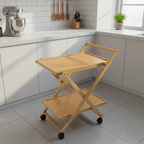 Wooden serving cart in a kitchen setting with white cabinets and appliances.
