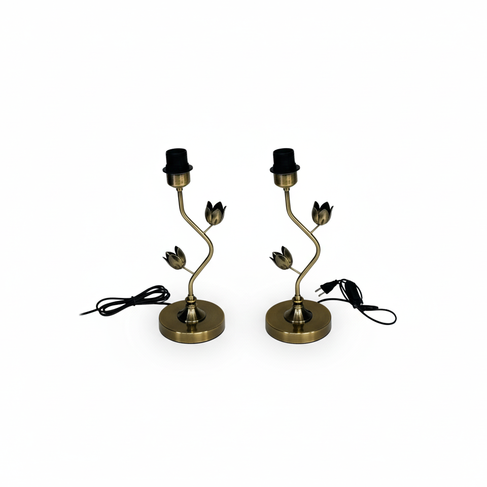 Two brass table lamps with top hat designs on a white background