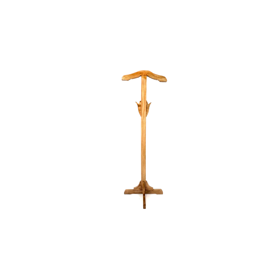Wooden boot jack on a white background