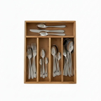 Wooden cutlery organizer with silverware on a white background