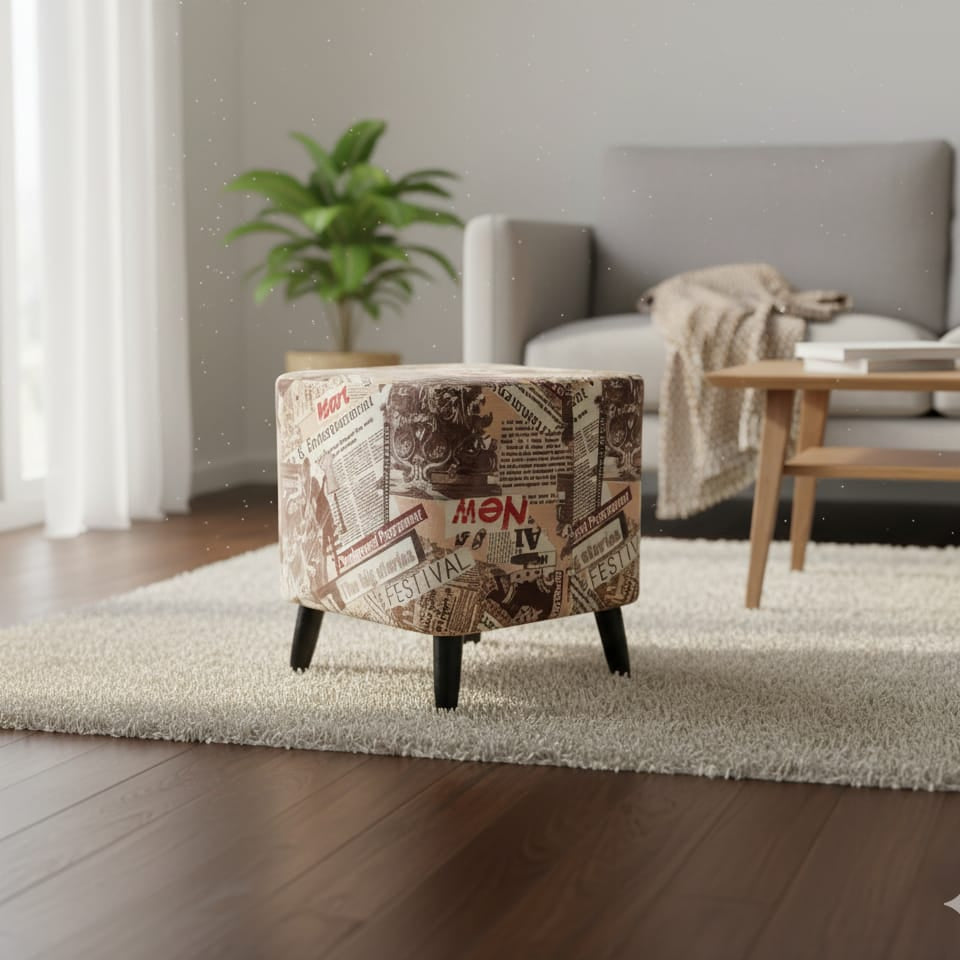 Patterned ottoman in a living room with a sofa and coffee table.