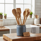 Set of wooden utensils in a blue container on a kitchen counter